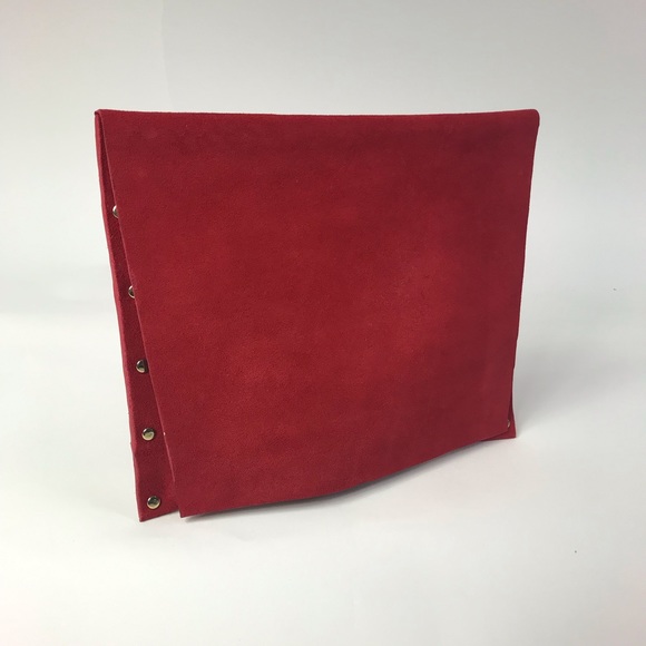 red suede clutch bag